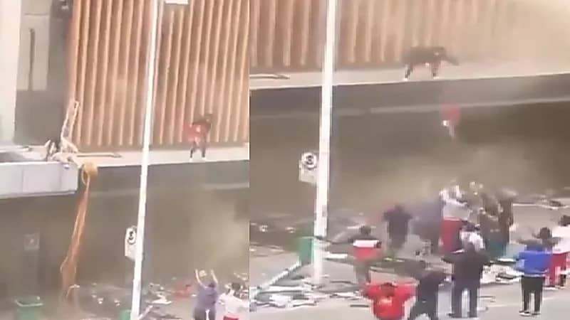 بالفيديو.. أم تلقي رضيعها من أعلى البناية بعد اندلاع حريق