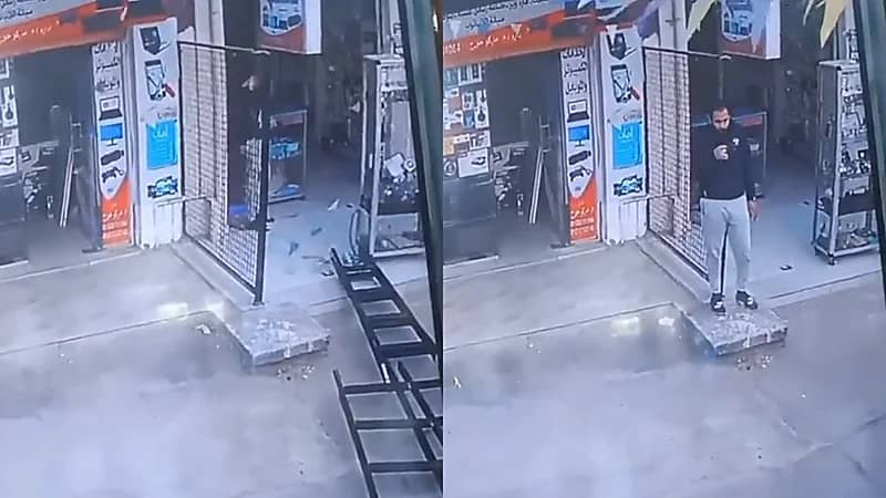 لحظة نجاة شاب من سقوط سلم من أعلى عقار ..فيديو