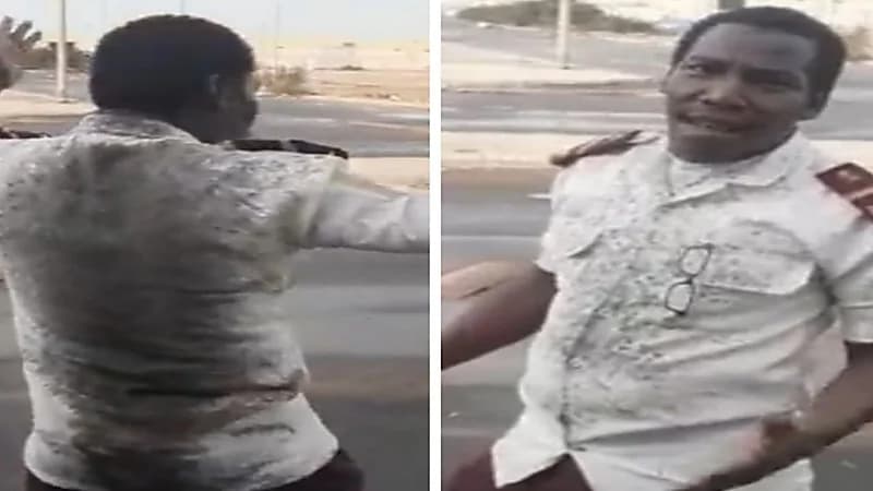 شاهد.. قائد مركبة يلطخ ملابس حارس أمن بالماء والطين  