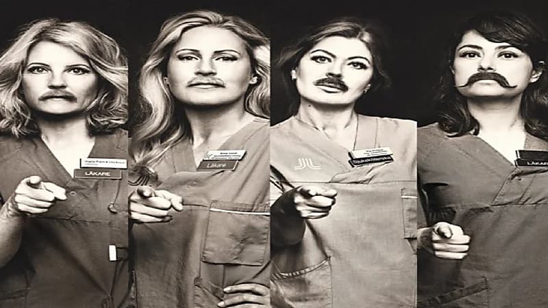 نساء يضعن شوارب مستعارة للاحتفاء باليوم العالمي للرجل